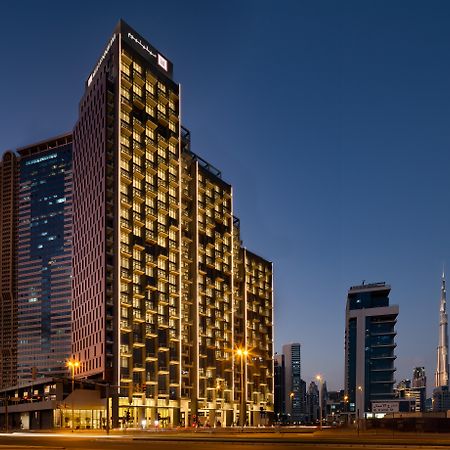 Millennium Atria Business Bay Aparthotel Dubai Exterior photo The hotel at night